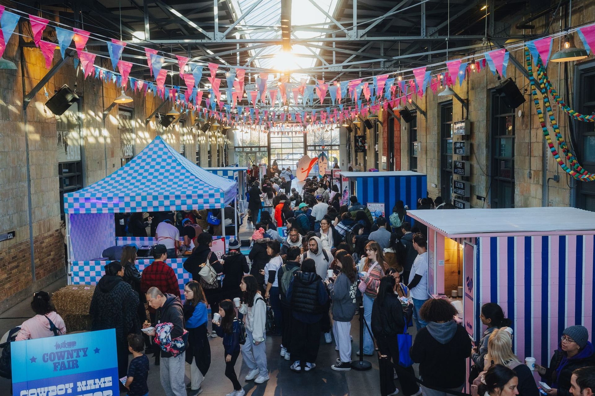 A crowd of people are gathered at a market.