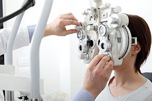 Contact Lenses — Woman Doing Eyesight Measurement in Joliet, IL