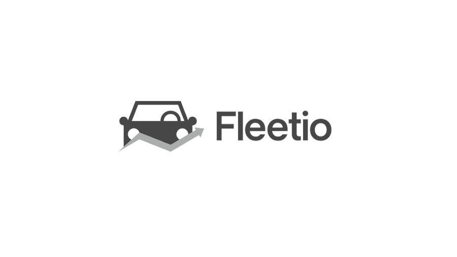 A black and white logo for fleetio with a car on a white background.
