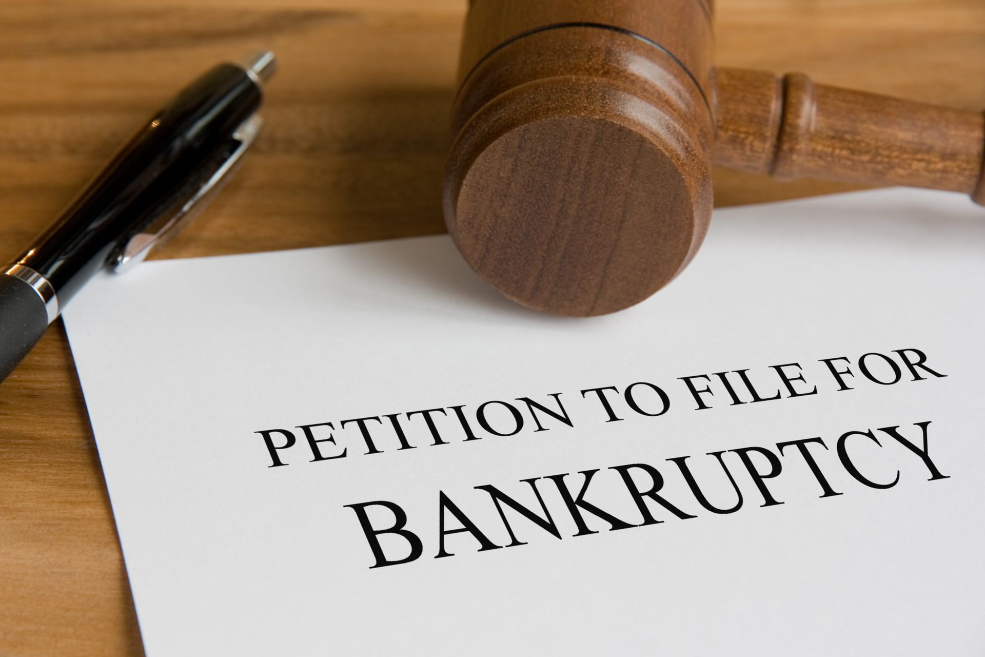 Bankruptcy Concept With Judge's Wooden Gavel And Petition Notice