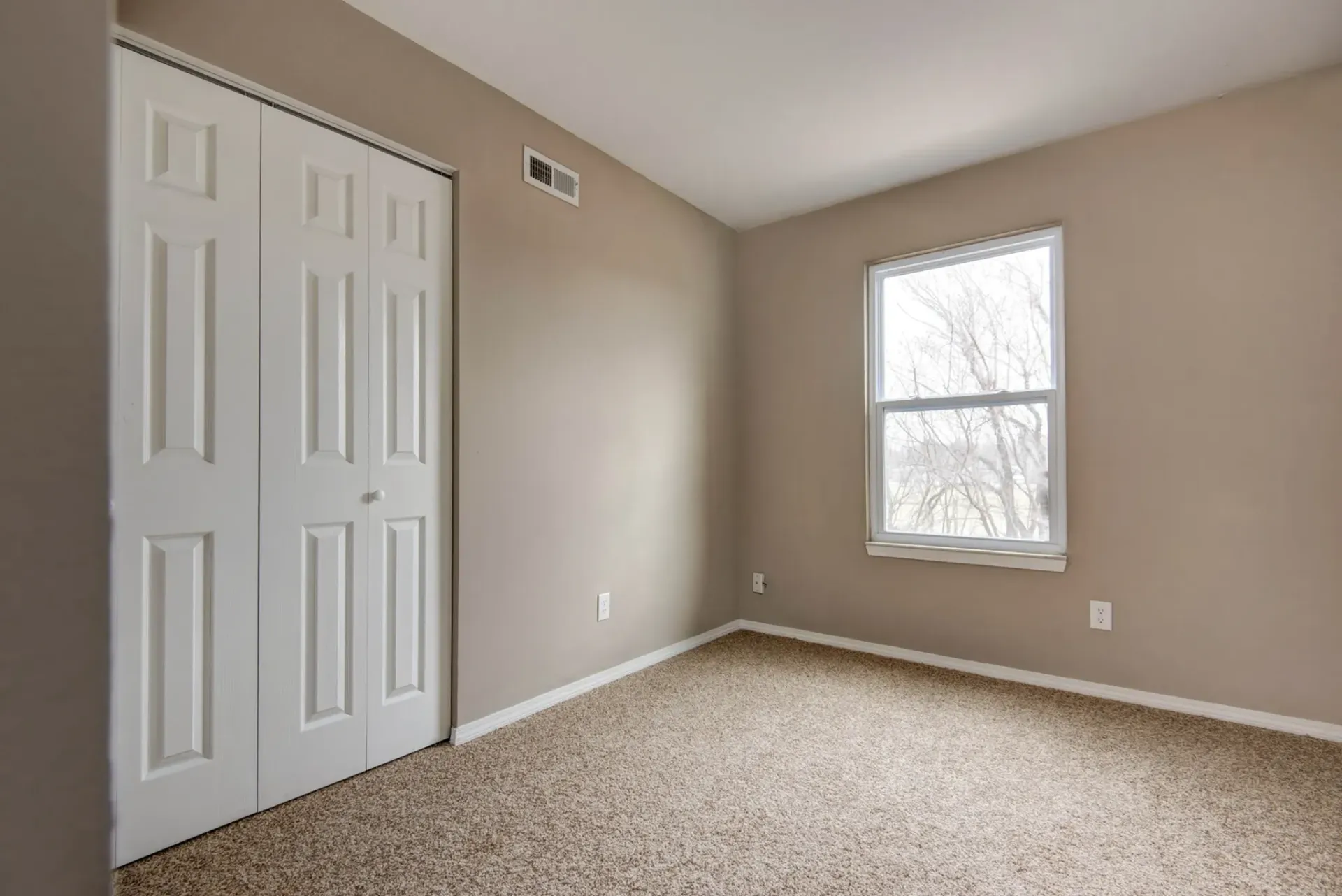 Photo of a beddroom with plenty of natural lighting