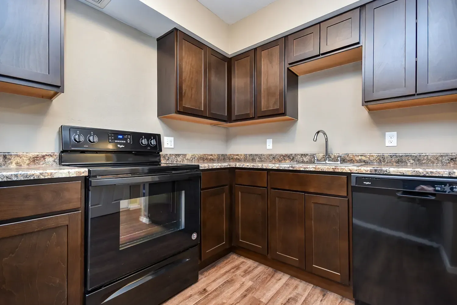 Photo of an L-shaped kitchen, with plenty of cabinet space