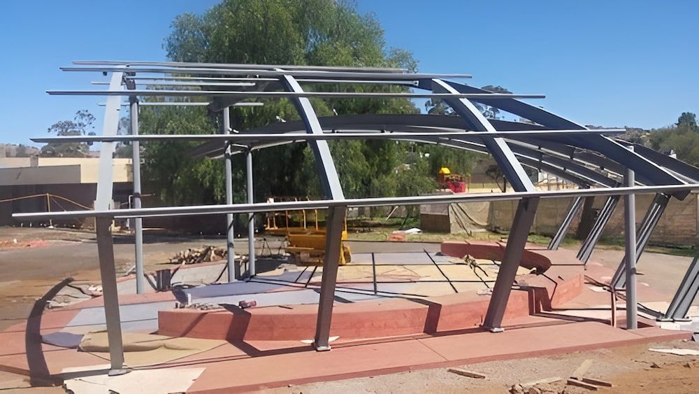 A Metal Structure Is Being Built In A Field — Jakes Steel & Welding in East Arm, NT