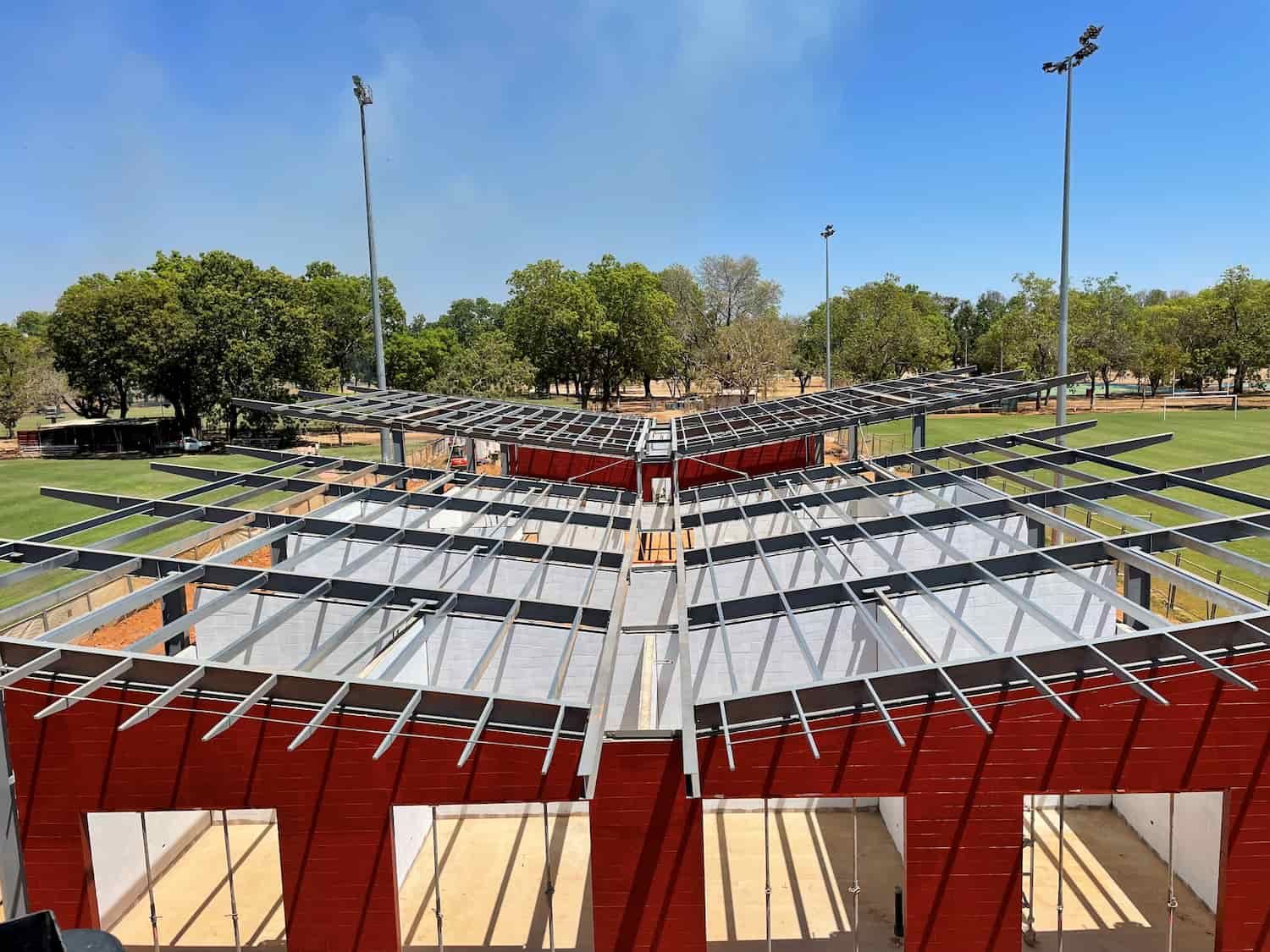 A Large Structure Is Being Built In A Park With Trees In The Background — Jakes Steel & Welding in East Arm, NT