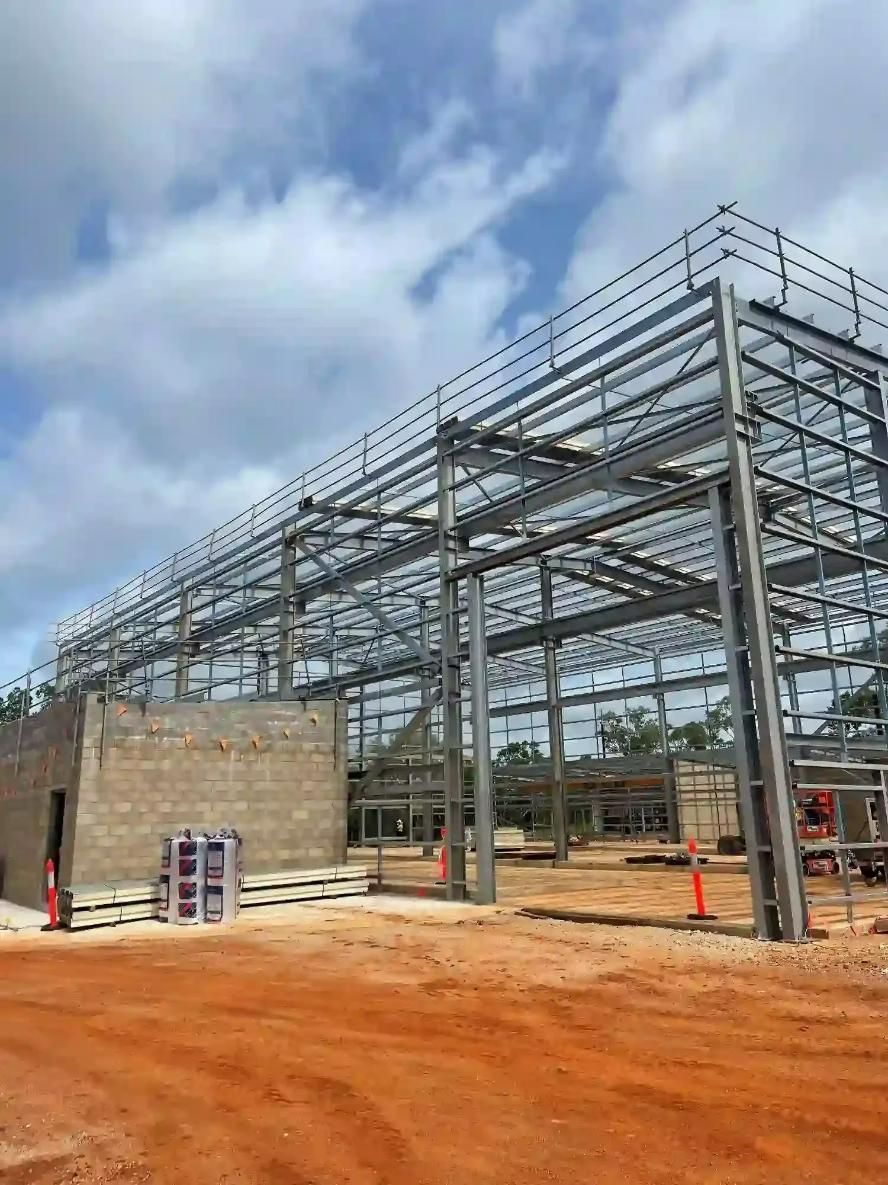 A Large Metal Structure Is Being Built On Top Of A Dirt Field — Jakes Steel & Welding in East Arm, NT