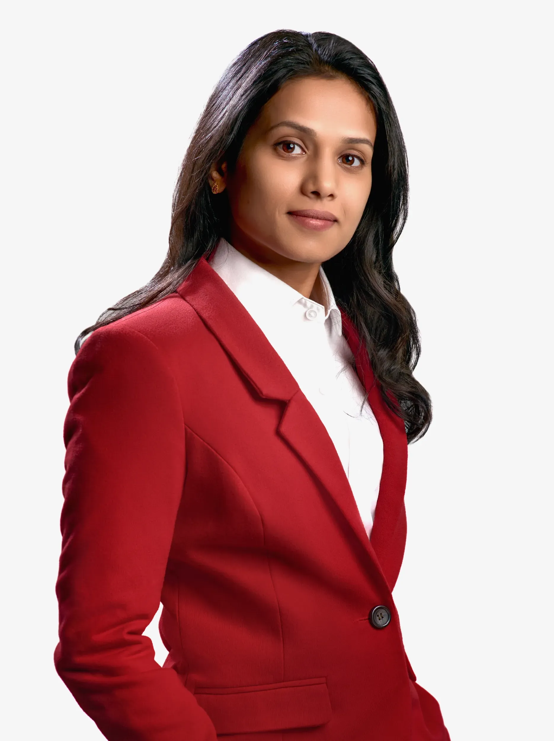 Woman in a red blazer and white shirt, looking towards the camera, against a white background.