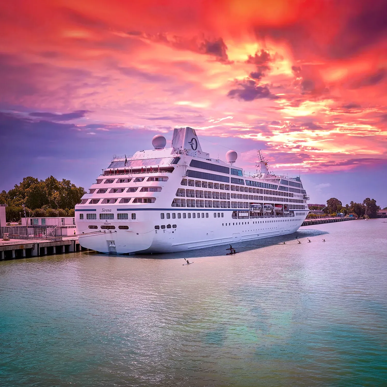 Modern blue glass hotel building with a large 