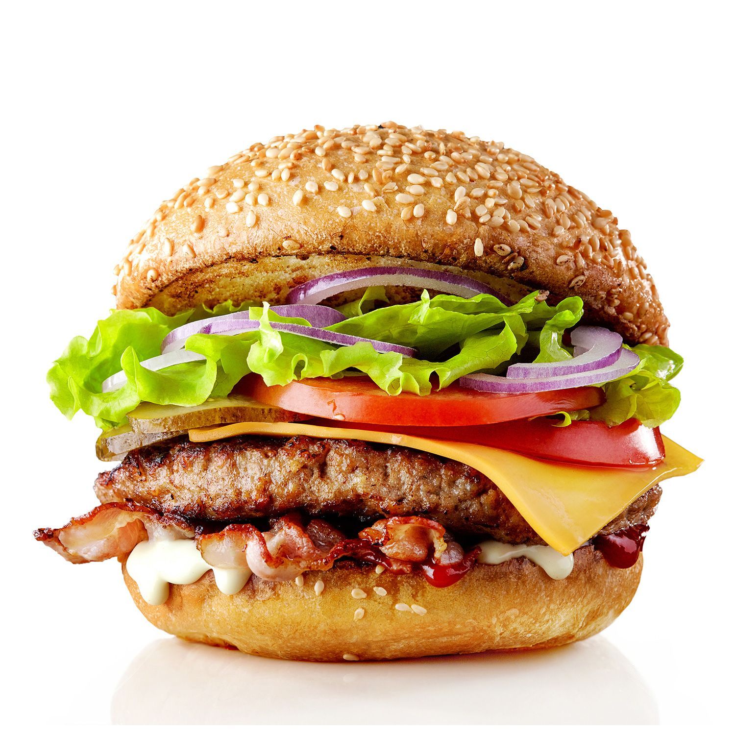 Burger with sesame seed bun, stacked with lettuce, tomato, onion, cheese, bacon, and patty.