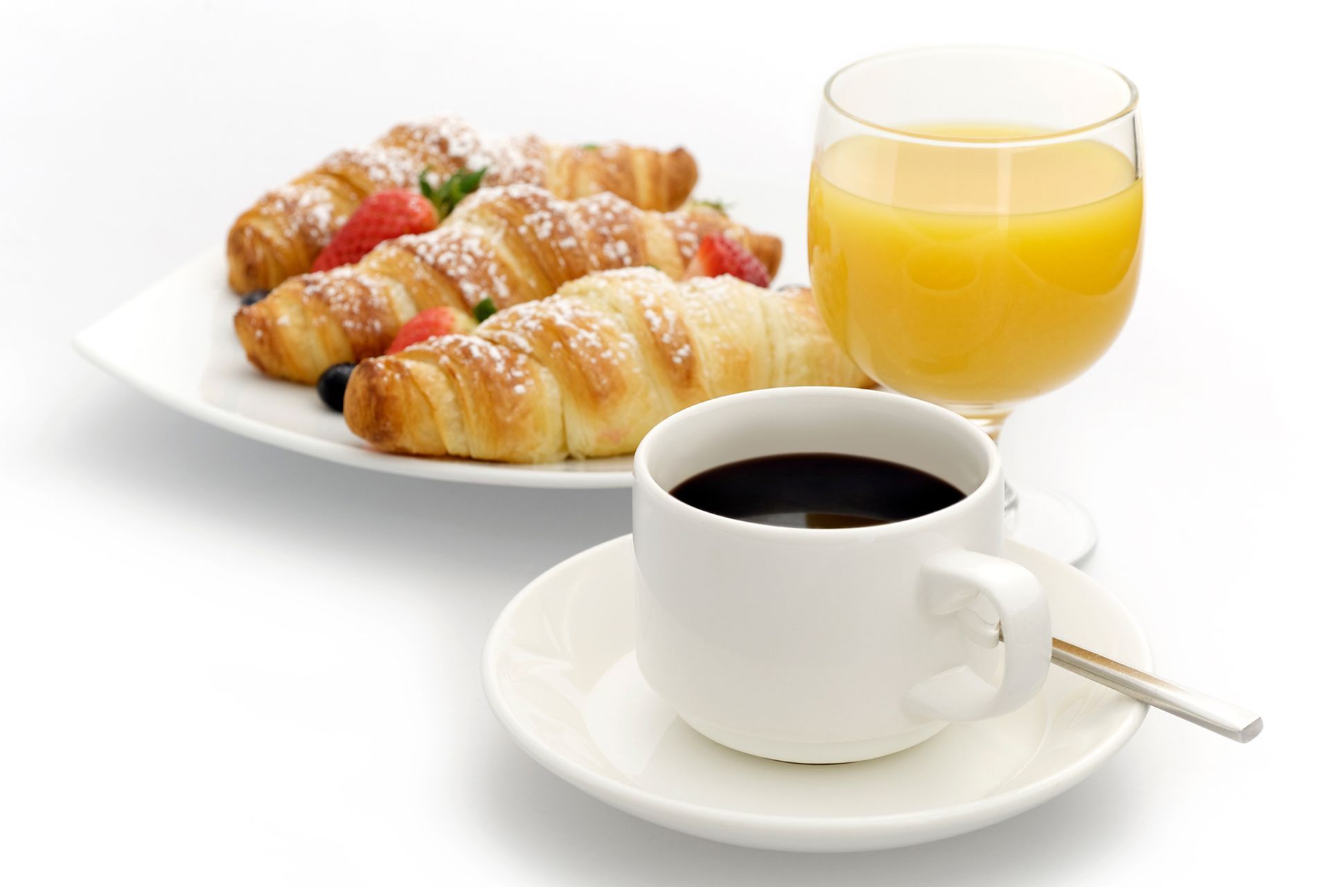 Breakfast: croissants, berries, coffee, and orange juice.