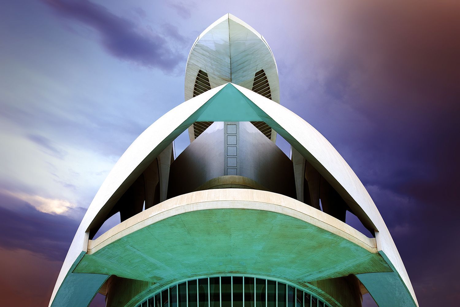 Modern architectural structure with white archways against a purple and blue sky.