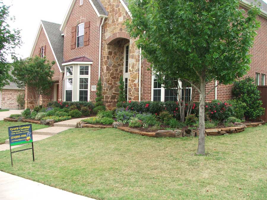 Frontside of a house with a landscaped lawn