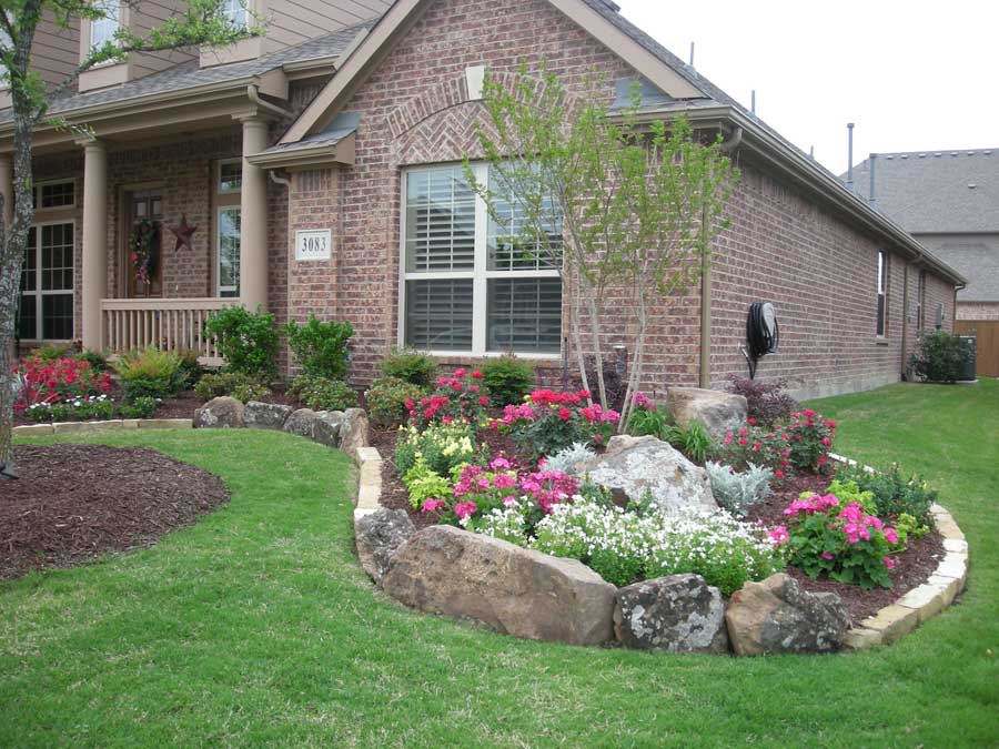 Lush flower garden outside of a window