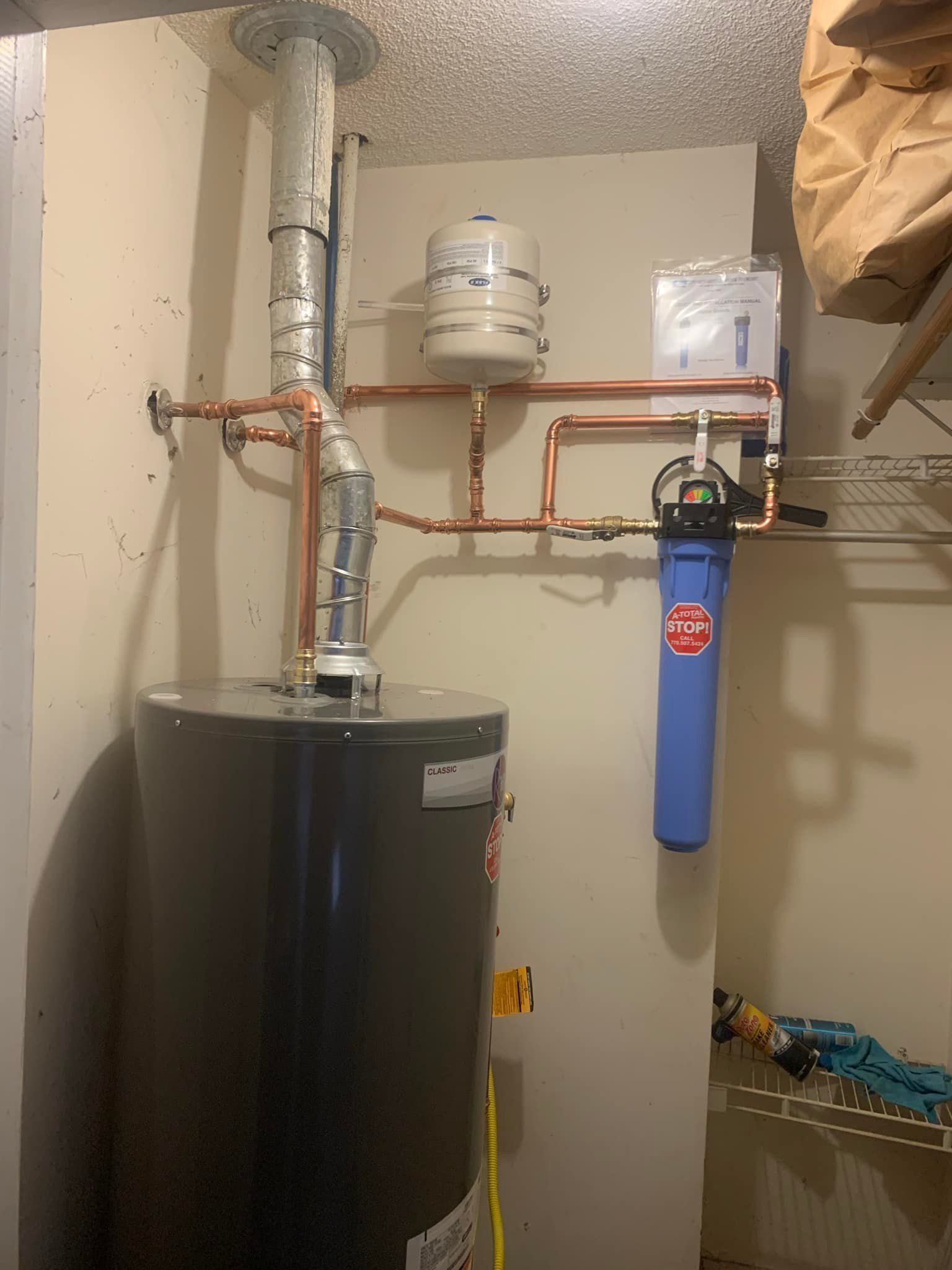 There is a water heater in the corner of the room.