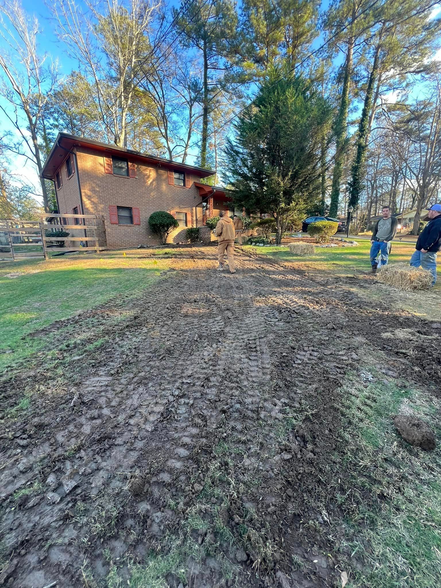 A couple of people are standing in front of a house.