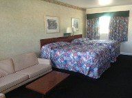 Motel Bed and couch | Belleair Village Motel | Largo, FL