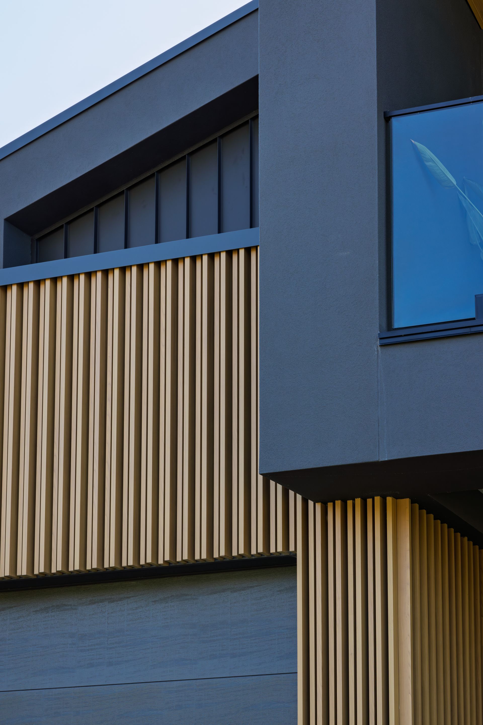 Modern custom home exterior with vertical timber detailing by Yarrum Designer Homes. 