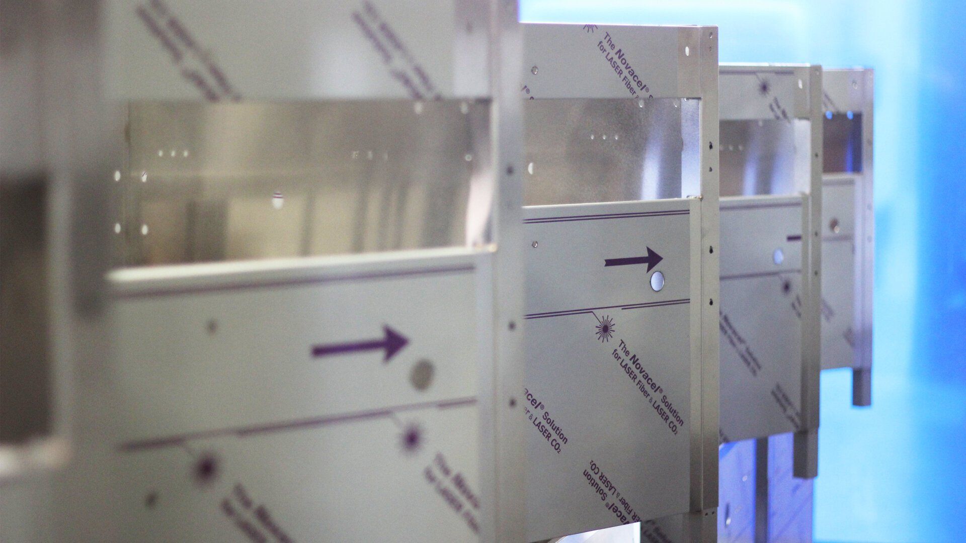 A row of stainless steel fabricated parts.