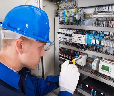 Electrician repairing the electrical circuit