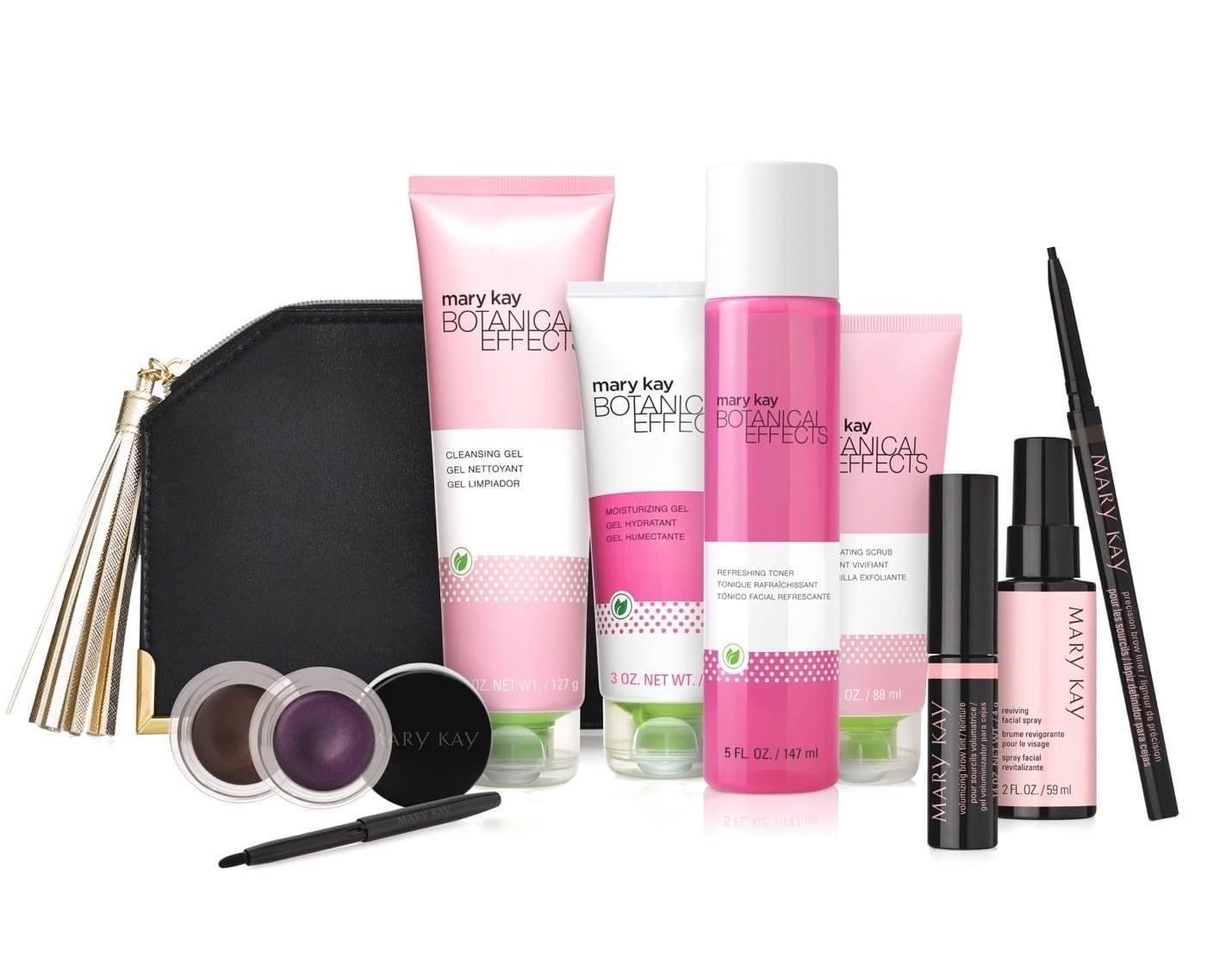 Makeup and skincare set with pink and white products, black bag, and eye makeup.
