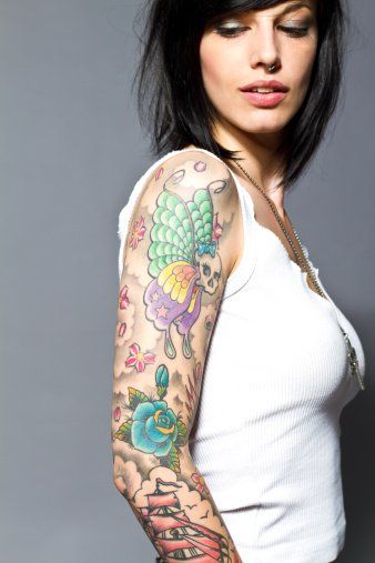 Woman with Beautiful Colored Tattoo — South Bend, IN — Electric Rose Inc