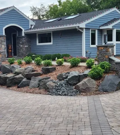 Decorative boulder installation in Loretto MN