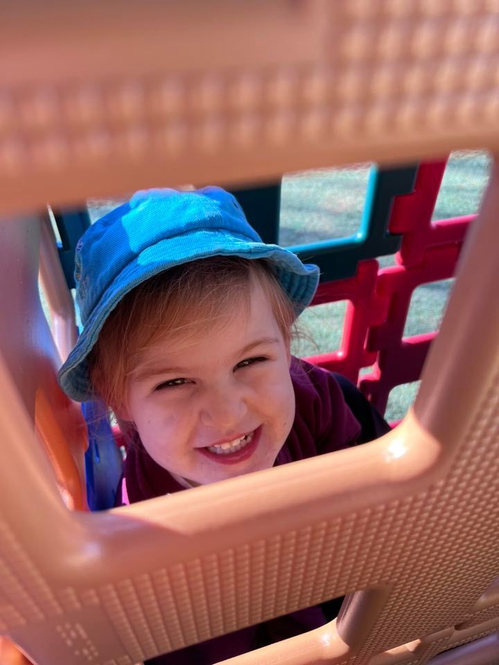 A Child Smiling — Earth Angels Child Care Centre in Tinonee, NSW