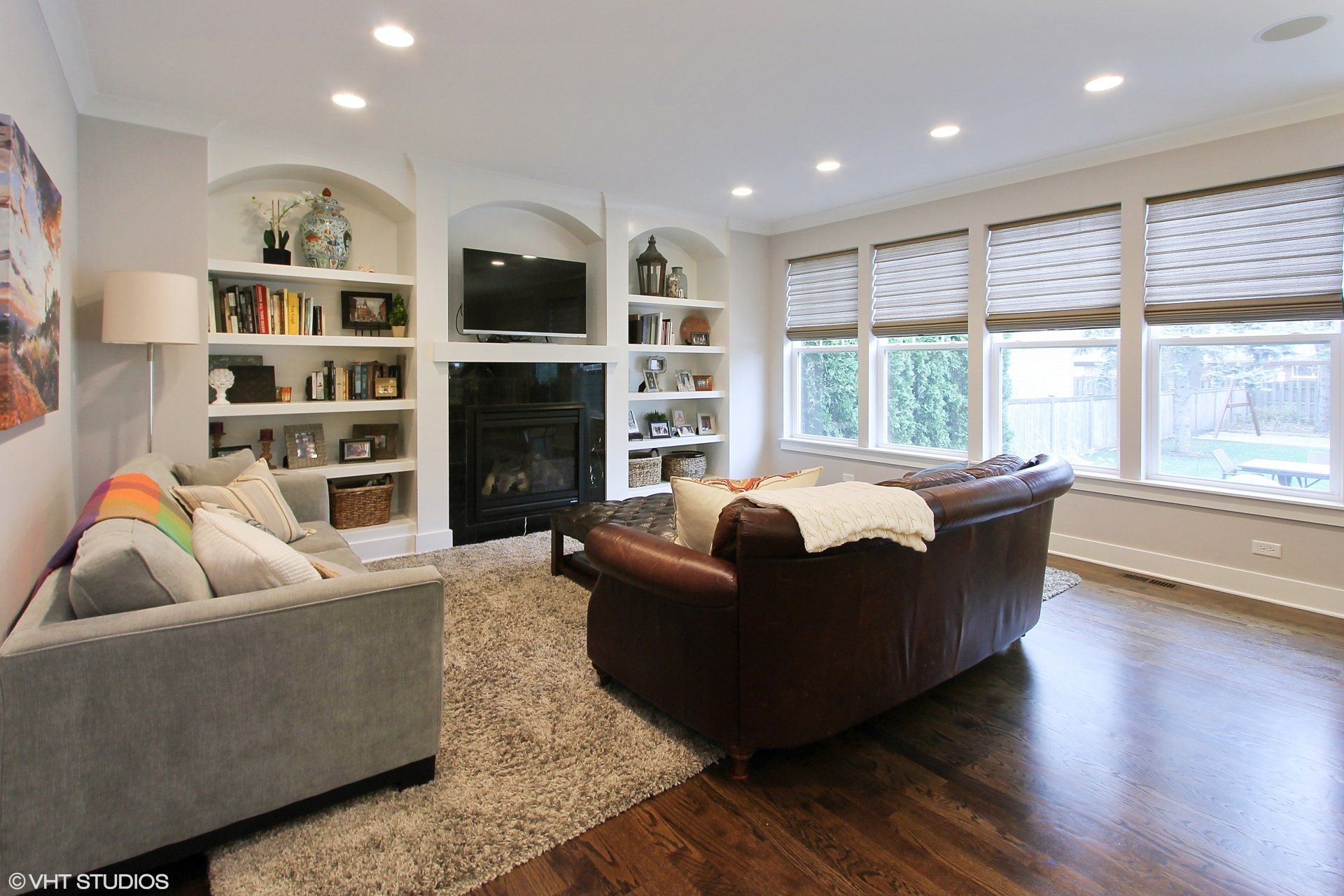 A living room with a couch and a fireplace