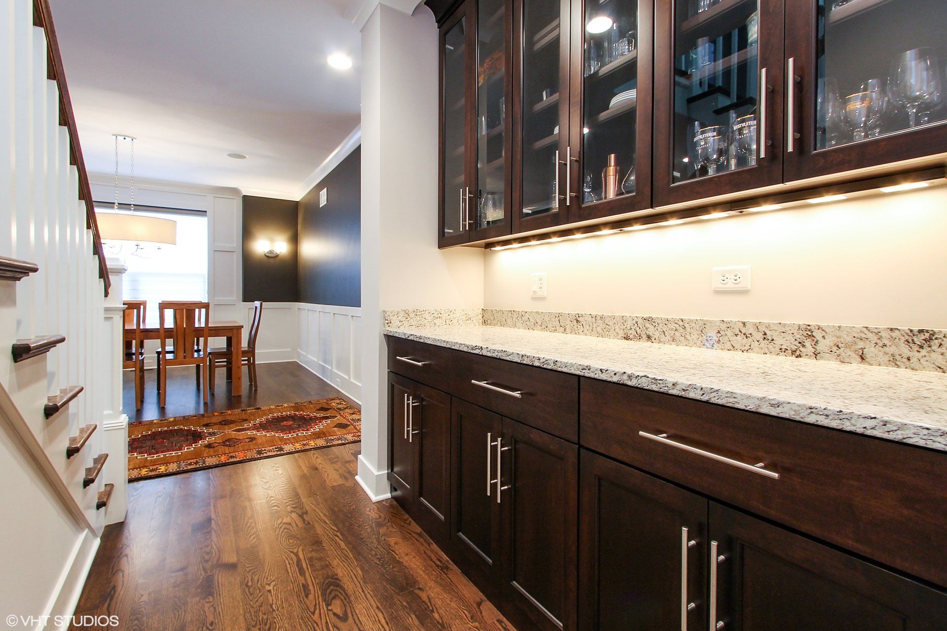 A kitchen with wooden cabinets and granite counter tops