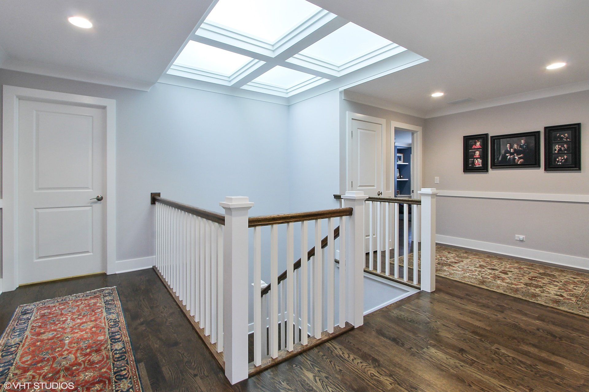 A staircase in a house with a skylight above it