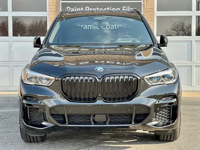 Black BMW with auto window tinting and paint protection film at High-Def Detailing