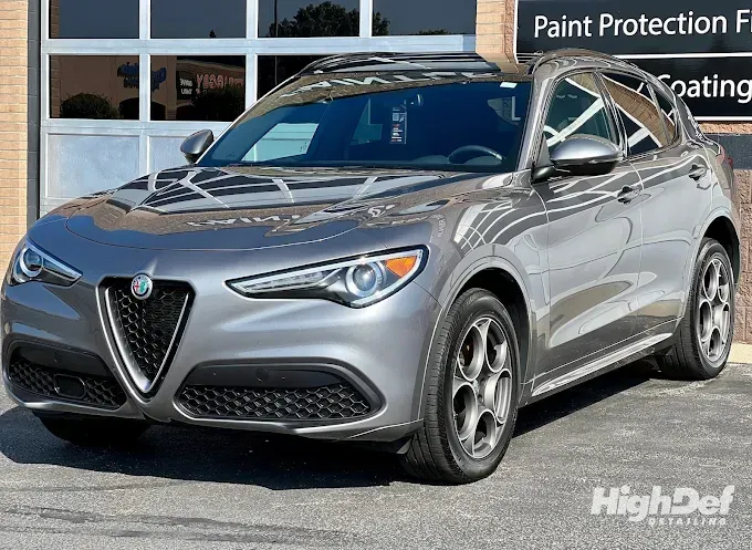 Gray Alfa Romeo Stelvio with auto window tinting and ceramic coating