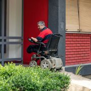 Man with disability on his electric wheelchair