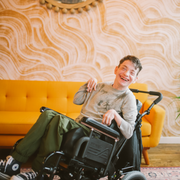 Young Teen with disability in wheelchair smiling