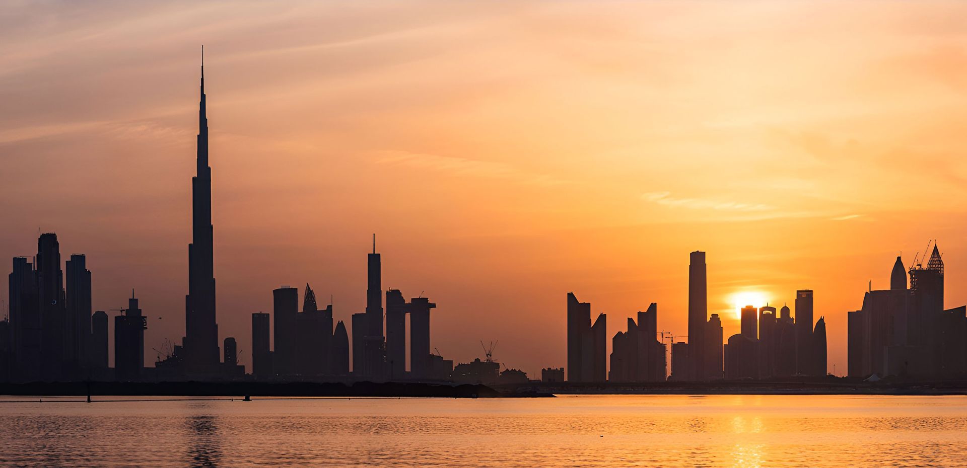 Dubai urban skyline during sunset.