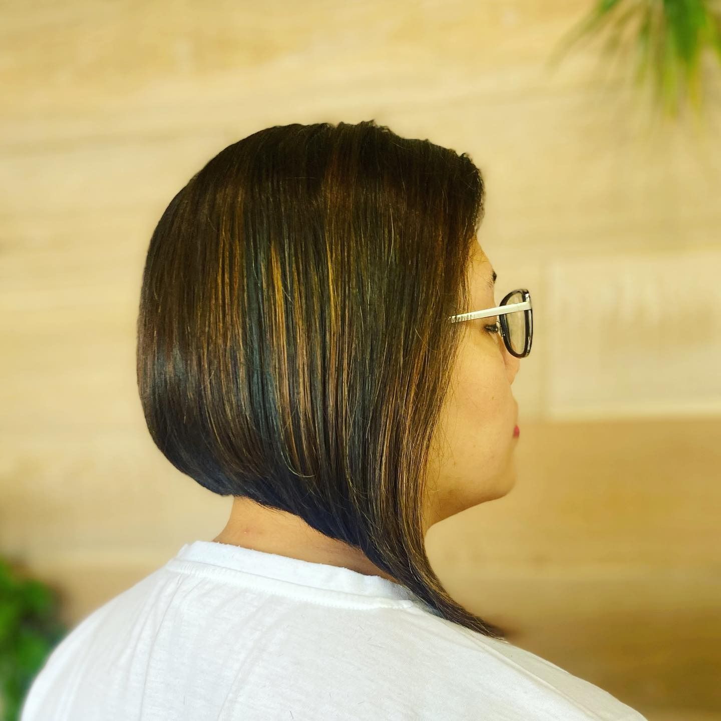 A woman wearing glasses and a bob hairstyle