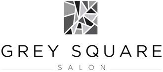 A black and white logo for grey square salon