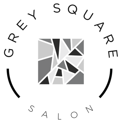 A black and white logo for a salon called grey square salon.