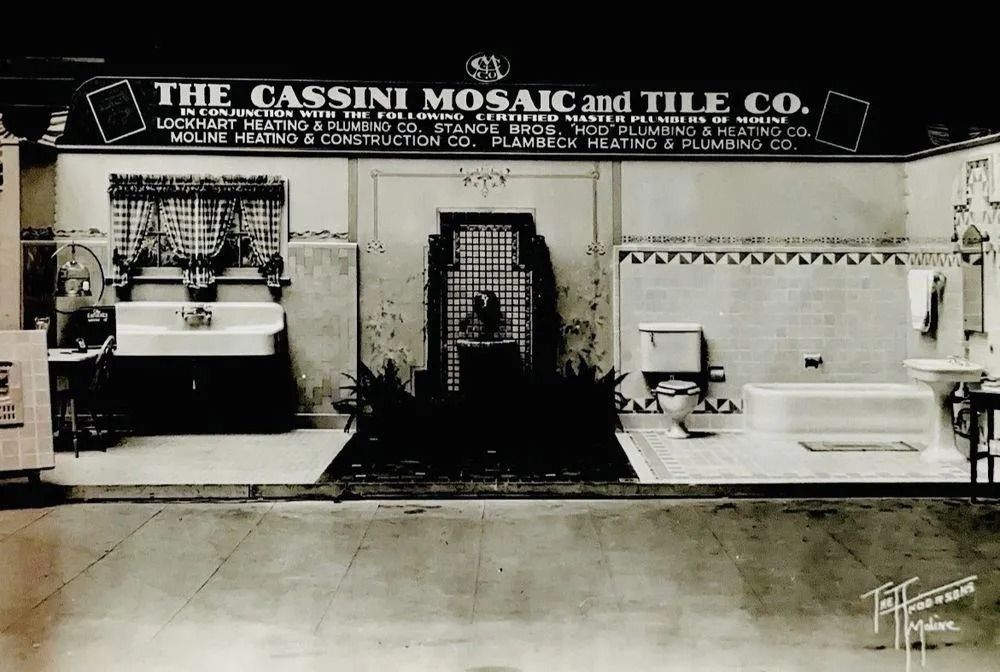 A black and white photo of a showroom display for the Cassini Mosaic and Tile Co.