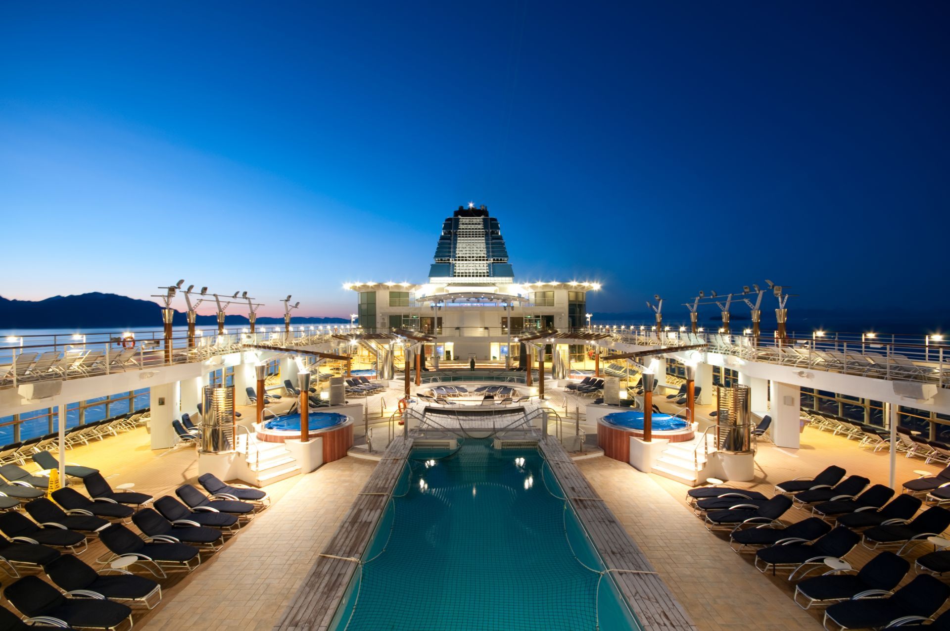 a luxury cruise ship with a swimming pool
