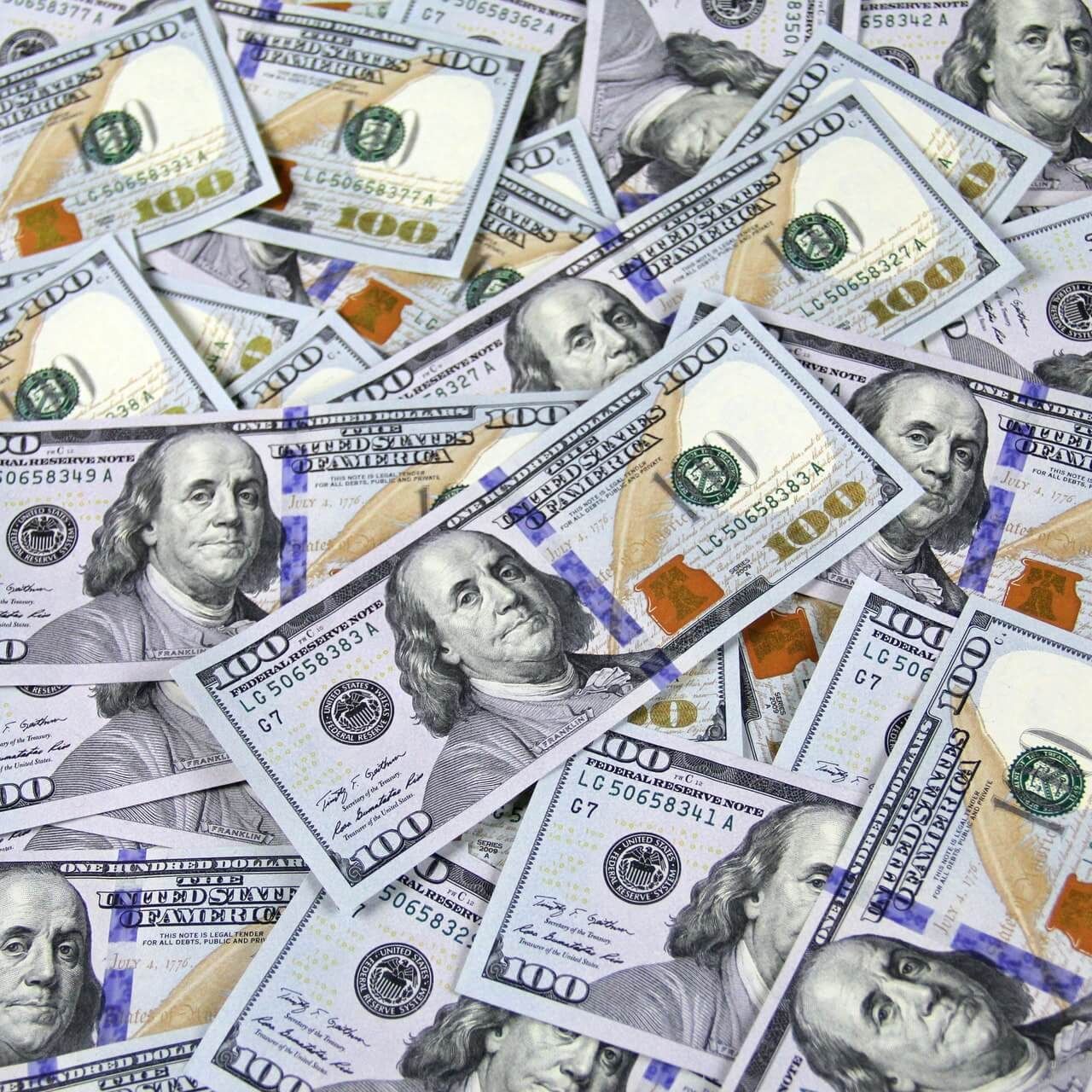 A pile of 100 dollar bills with franklin on them
