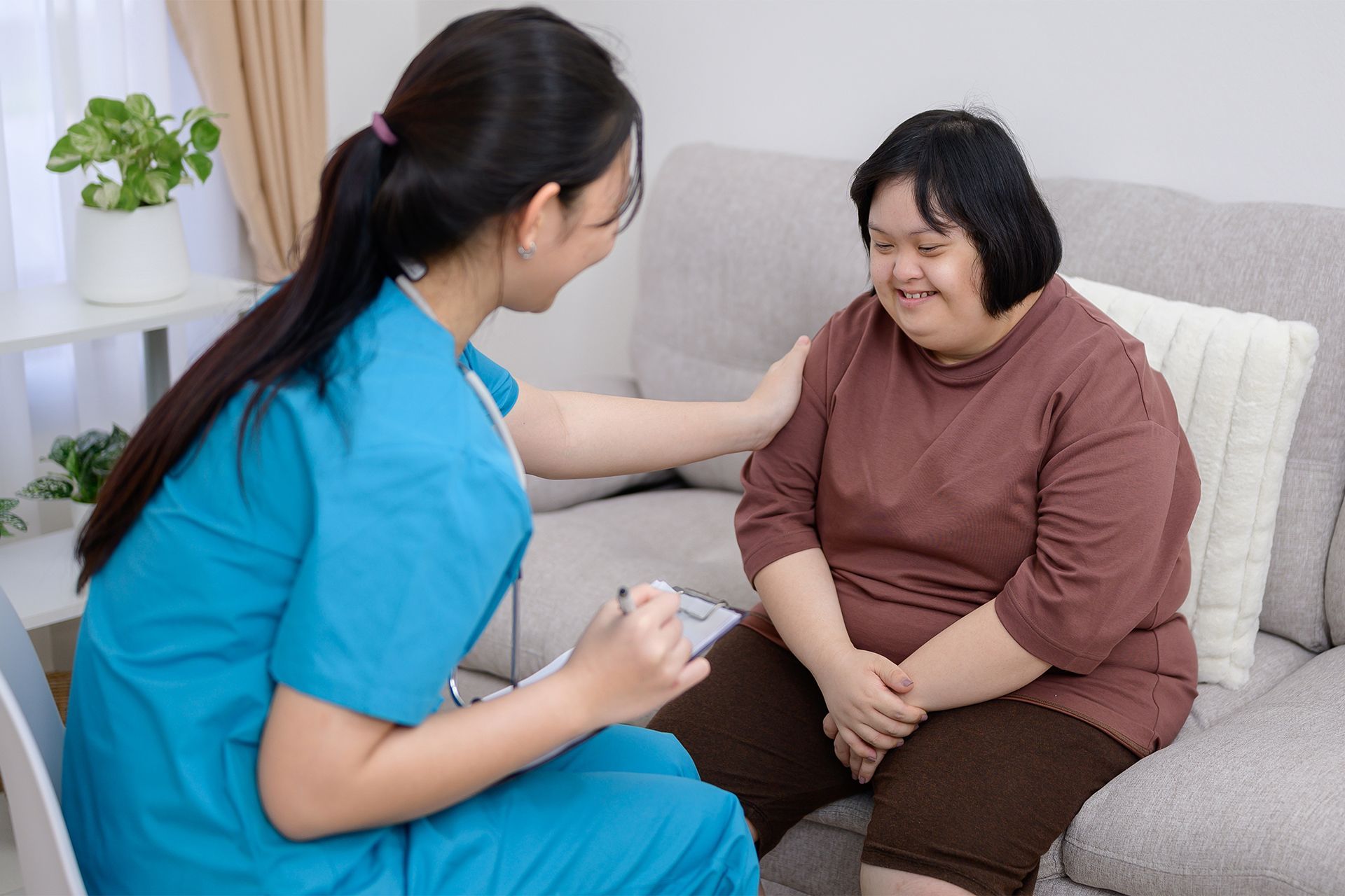 Caregiver Talking to Her Patient