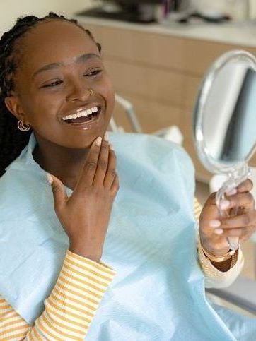 woman smiling mirror