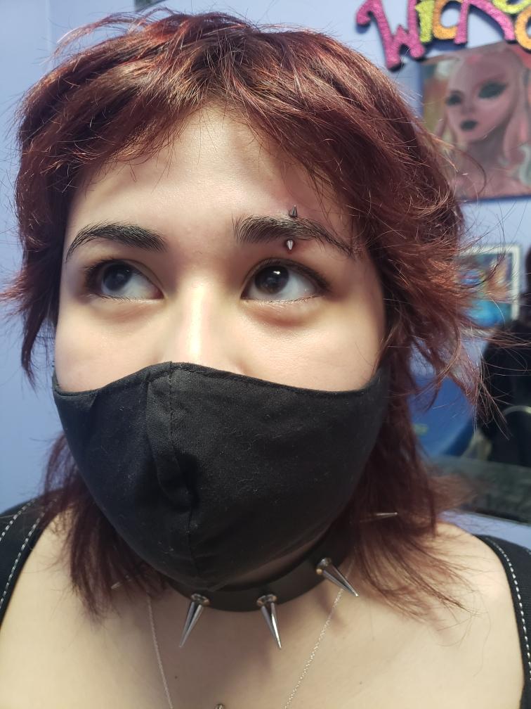 Eye Brow Piercing Female Customer — Skin Graphics Tattoos & Body Piercing — San Antonio, Texas