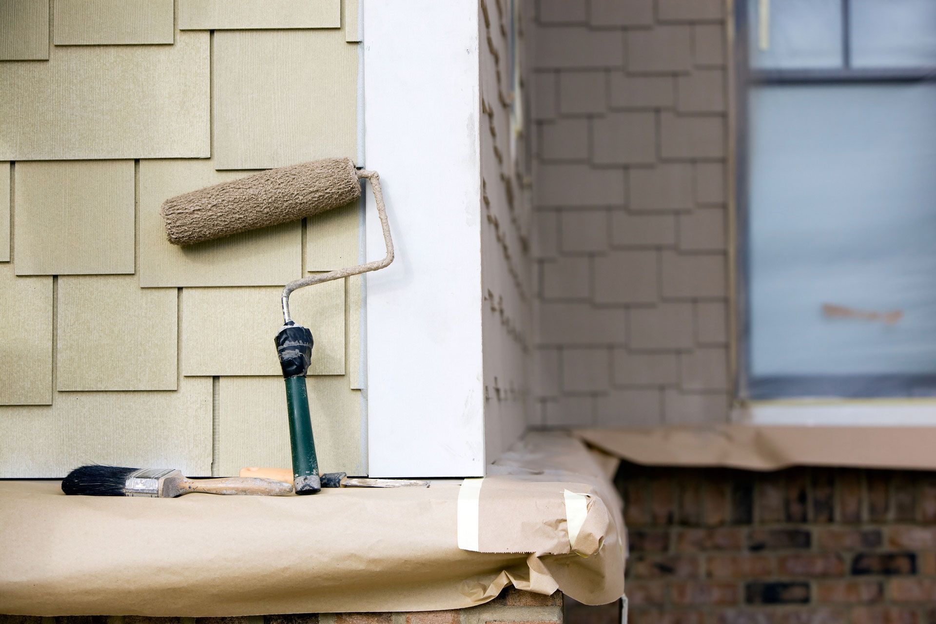 Paint Brush and House Exterior — Los Osos, CA — Pacific Coast Painting and Design Inc