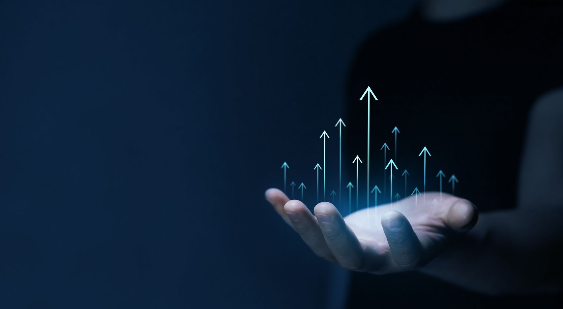 A person is holding a bunch of arrows in their hand.