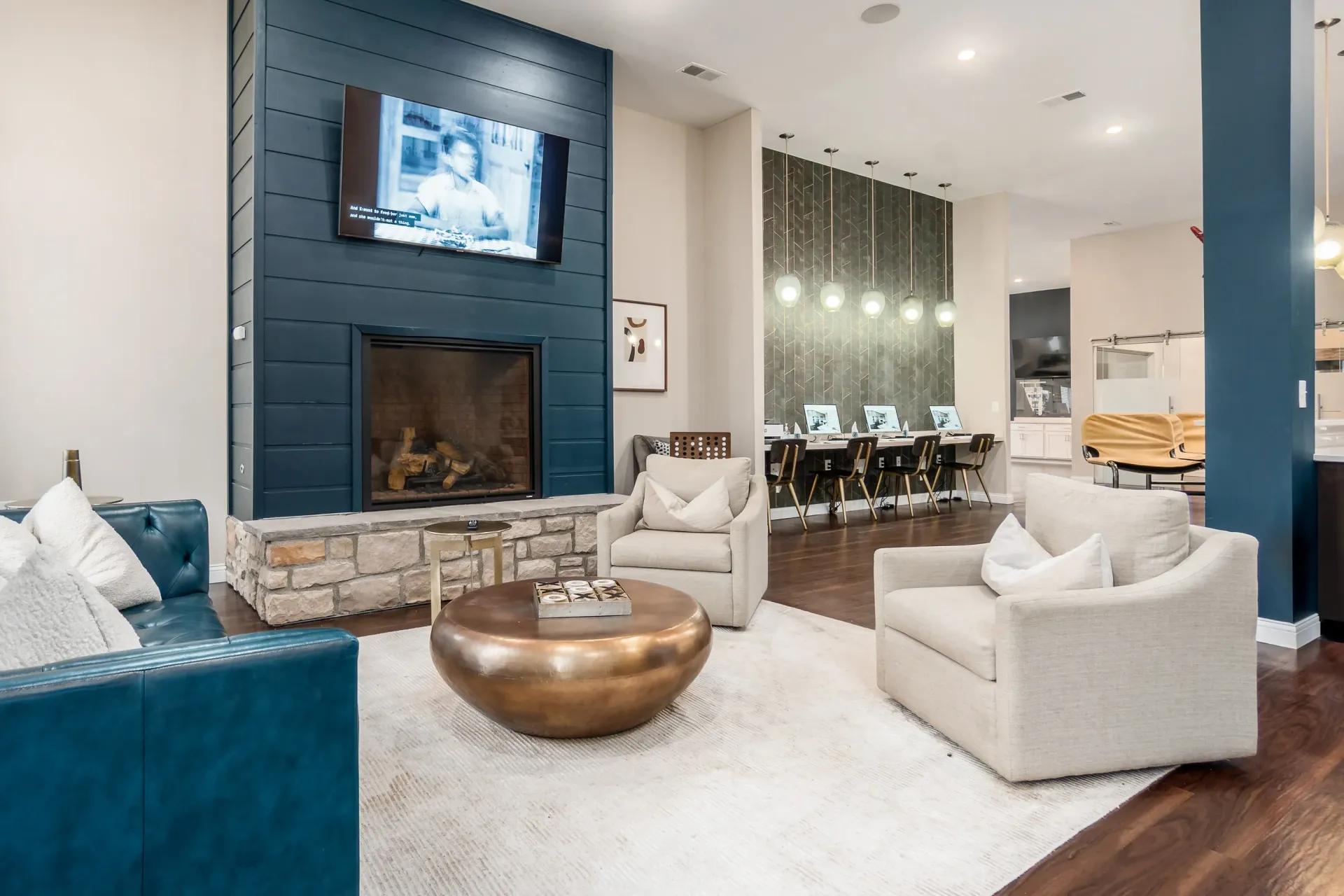 Comfortable seating area with a fireplace and a computer lab in the background.