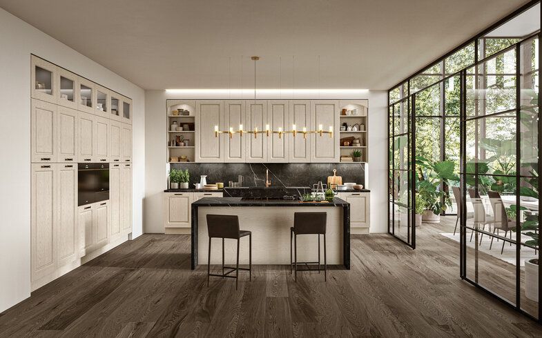 cucina con ripiano snack e sgabelli