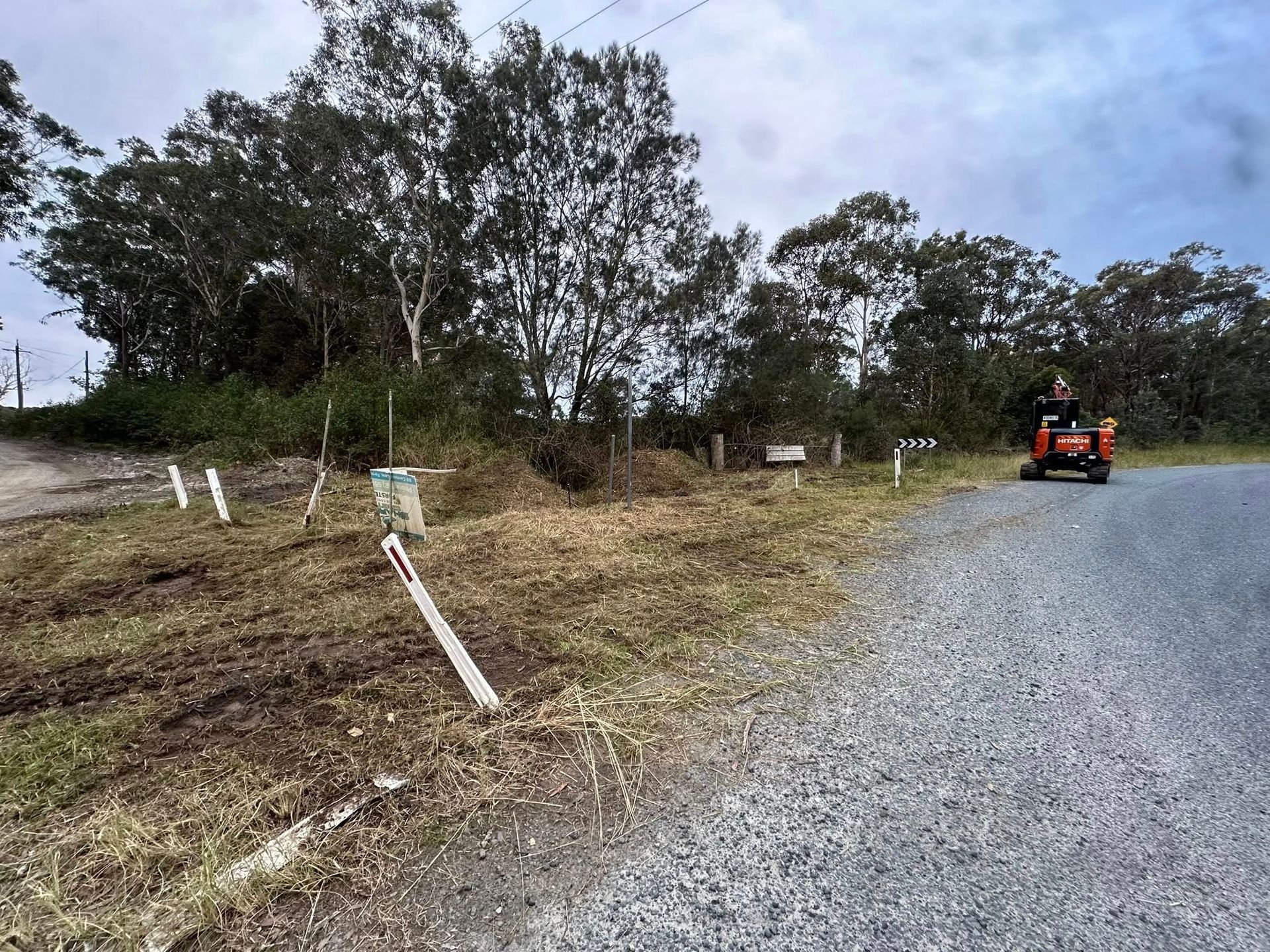 Person on a Riding Mower on a Gravel Road — Ace Clearing & Mulching In Forster, NSW