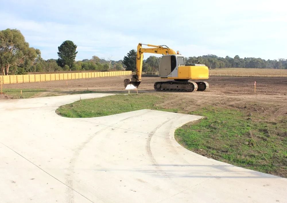 Yellow Excavator on a Construction Site — Ace Clearing & Mulching In Old Bar, NSW