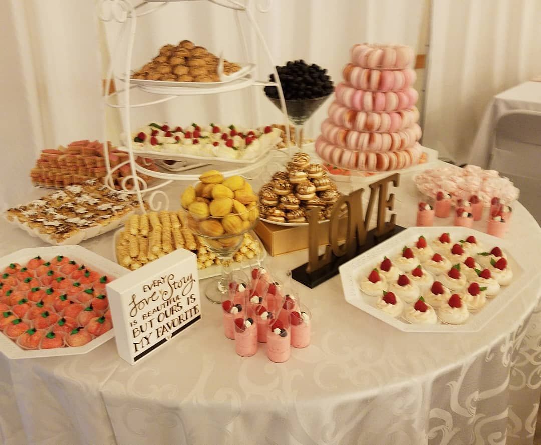 A table with a lot of food on it and a sign that says love